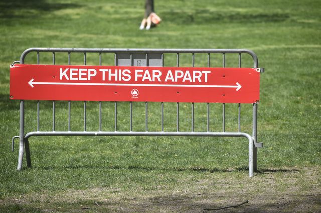 A photo of a sign reading "keep this far apart"